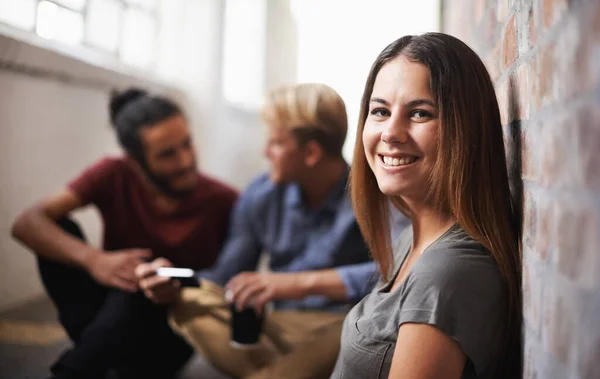 stock image Taking a load off after class. students relaxing in the hallway