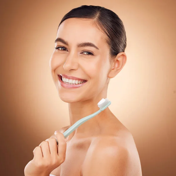 Woman, toothbrush and smile in studio portrait for wellness, self care and beauty by gradient background. Happy healthcare model, dental health and toothpaste for mouth hygiene, cleaning and teeth.
