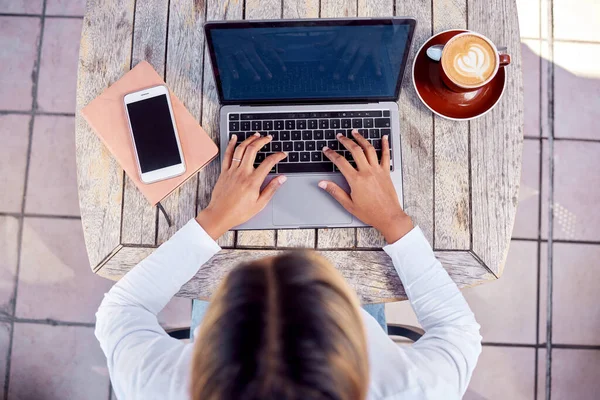 stock image Hands, laptop and woman from above with coffee, freelance writer typing with online remote work in cafe. Freelancer, blogger or content creator writing social media post, email or research article