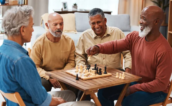 Chess, friends and board games on wooden table for strategic, cocky or tactical move at home. Senior group of men playing and holding white knight piece after attack showing skill and tactics.