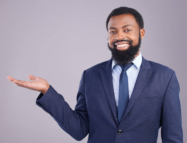 Portrait, black man and product placement for business in studio isolated on a gray background. Marketing, mockup and smile of happy African professional with branding, advertising or mock up space
