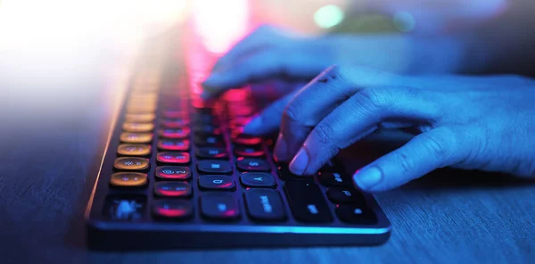 Hacker, hands and typing on neon keyboard for software, programming or cybersecurity. Developer, it coder and woman on computer keypad for hacking, phishing and dark web malware at night in home
