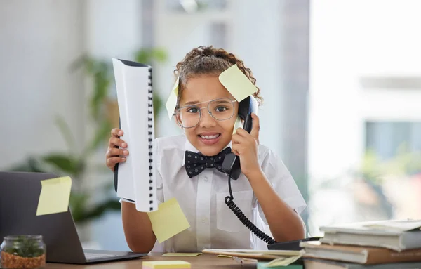Telephone, stress and child boss in the office with sticky notes and anxious, annoyed and upset face. Frustration, landline and girl kid ceo on a phone call by the desk working in a modern workplace