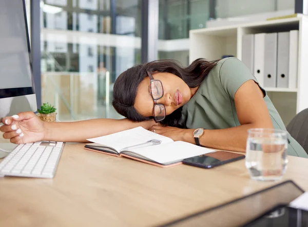 Tired woman sleeping on her desk with office depression, burnout and mental health risk for project deadline or overworked. Business African person, worker or employee sleep, fatigue and low energy.