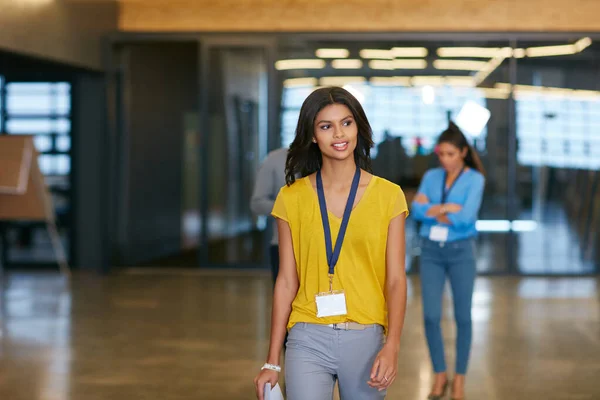 stock image Headed into work for the day. a young businesswoman walking into work