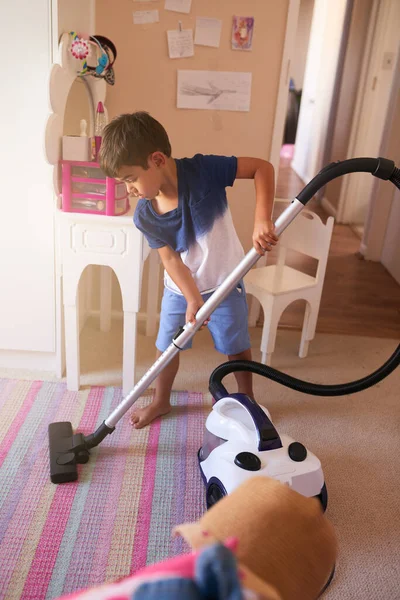 stock image Its his turn to vacuum today. a little boy vacuuming his bedroom at home