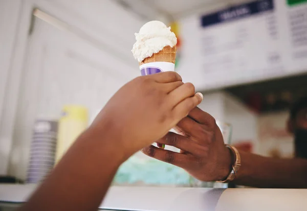 Hands, customer and ice cream for woman buying cone at local shop for small business support. Counter for sugar, dessert and gelato purchase snack from seller person to enjoy frozen product in summer.