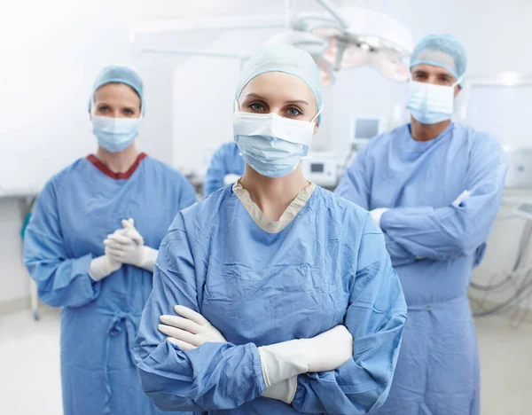 Together Make Miracles Portrait Four Surgeons Wearing Hospital Scrubs Face — Stock Photo, Image