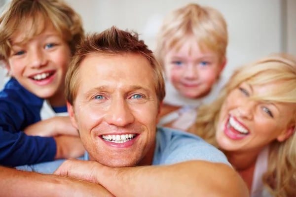 Smiling mature man spending good time with his family. Closeup of a smiling mature man spending good time with his family