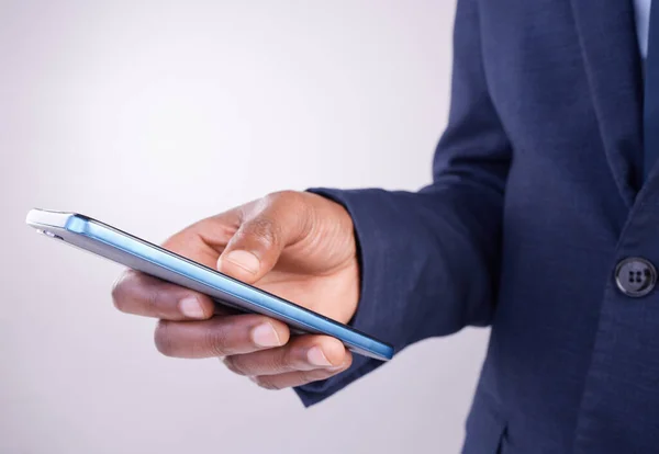 stock image Hands, man and smartphone texting in white background for business app, planning and internet search. Closeup male, mobile typing and studio connection on technology, corporate networking and contact.