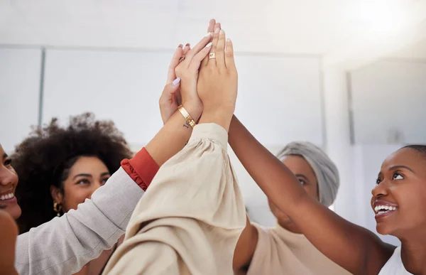 High five, women or happy business people celebrate achievement, profit growth or start up success. Solidarity, community and team building celebration for teamwork, collaboration or cooperation.