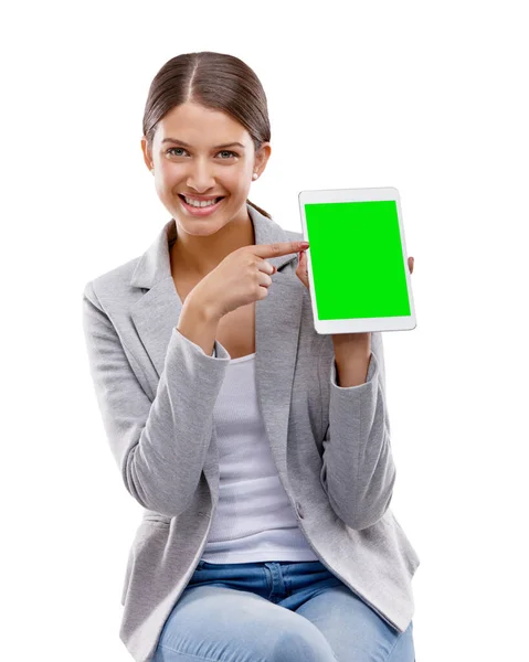 stock image Be the first to try out this app. Studio shot of a beautiful young woman holding up a digital tablet with a chroma key screen against a white background