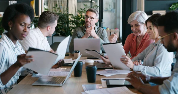 stock image The get it done group. a group of businesspeople having a meeting in a modern office