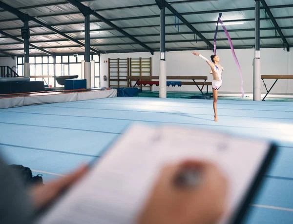 stock image Ribbon dancing, dance exam and woman gymnast with fitness, performance art and training. Gymnastics, girl and show of a gymnastic dancer in a exercise competition with creative workout and checklist.