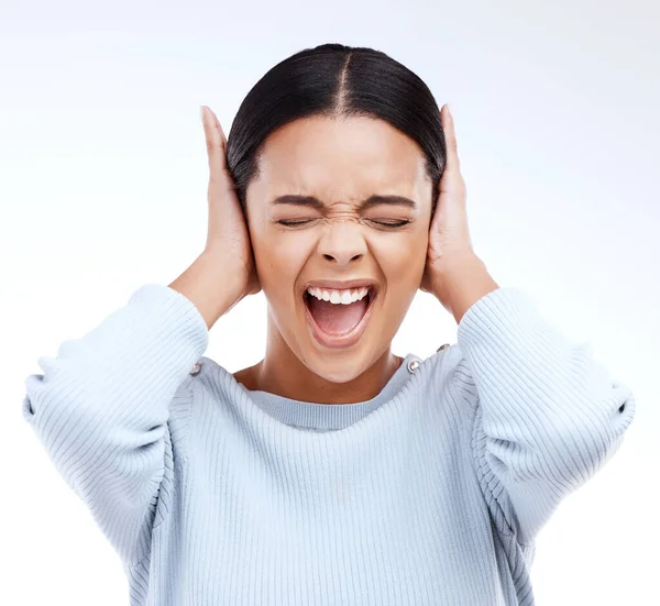 Shouting, woman and hands on ears for noise, silence or denial gesture on studio white background. Anxiety, face and annoyed girl in stress, ignoring and deaf or wtf, emoji and frustrated expression.