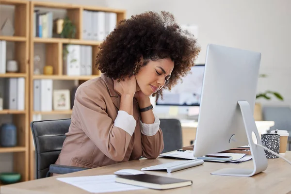 Burnout, office or woman with neck pain injury, fatigue or bad ache in a business or company desk. Posture problems, tired girl or injured female worker frustrated or stressed by muscle tension.