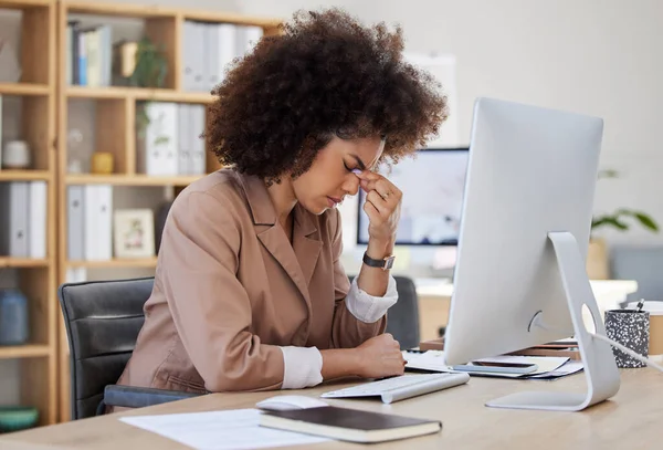 Headache, migraine and frustrated woman on computer stress, depression or health risk in office working. Pain, depressed or angry, biracial business person with burnout or fatigue for online career.