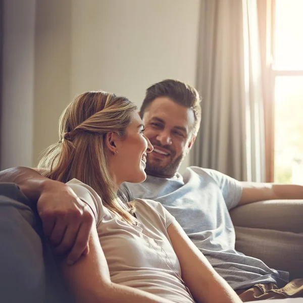 stock image Do we really have the day all to ourselves. an affectionate young couple relaxing on the sofa at home