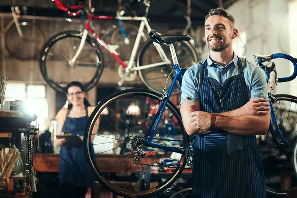 On a mission to make your bike great. a mature man working in a bicycle repair shop