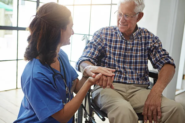 stock image Im here for you. a female nurse talking to a senior patient in the retirement home