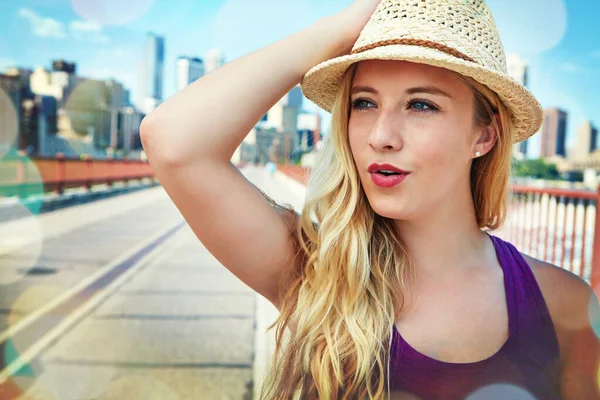 stock image Moving to a big city is liberating. a smiling young woman walking around the city in the summertime