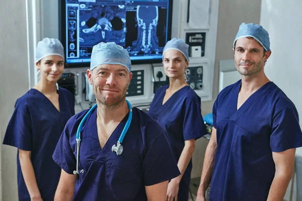 Your health is important to us. Portrait of a team of surgeons in a hospital