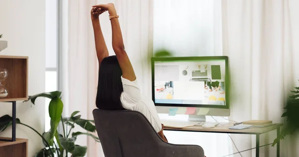 Woman doing stretch from online work on laptop. Businesswoman stretching for posture, fitness and health while working remote. Balance, stress relief and taking a break in office to relax.