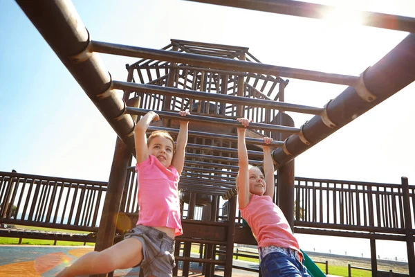 Sliding into the fun. a young girl sliding down the slide on a