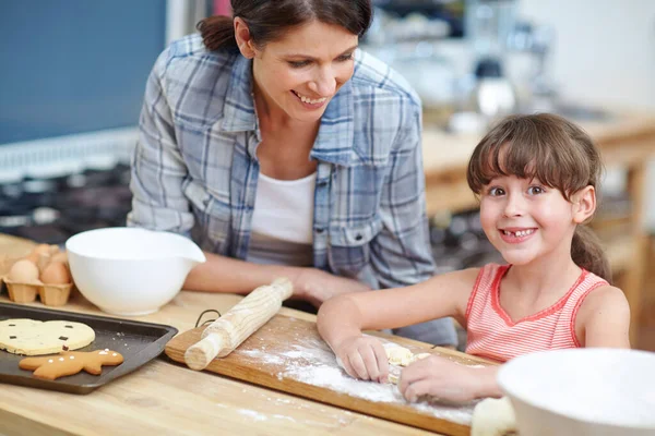 I love mom like milk loves cookies. a mother and daughter baking together