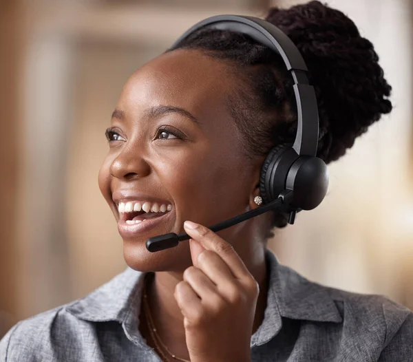 stock image Call center, black woman and happy in contact us, CRM and headset with mic and communication. Customer service consultant, female and smile in telemarketing sales vision and help desk agent in office.