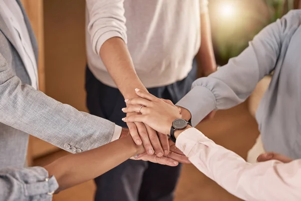 Stock image Business people, hands and teamwork in collaboration for meeting, trust or unity and community at the office. Hand of group piling hand together for celebration, success or company goals at workplace.