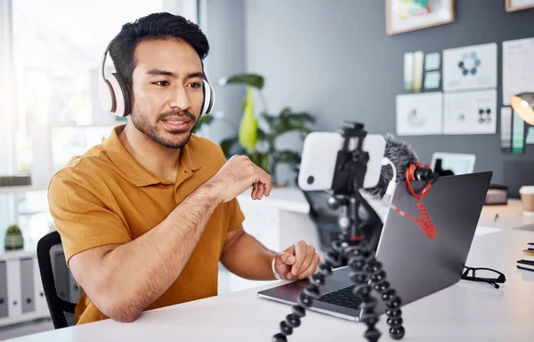 Podcast, streamer and live broadcast with a man influencer recording tutorial content in his home office. Internet, freelancer and subscription with a creative male vlogger working in his studio.