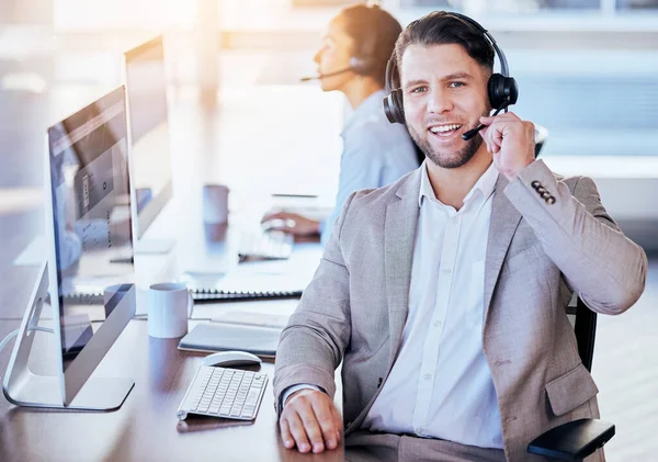 Man, call center and microphone with smile in office for crm, contact and customer service job. Consultant, happiness and listening on voip call for tech support, advice or telemarketing in workplace.