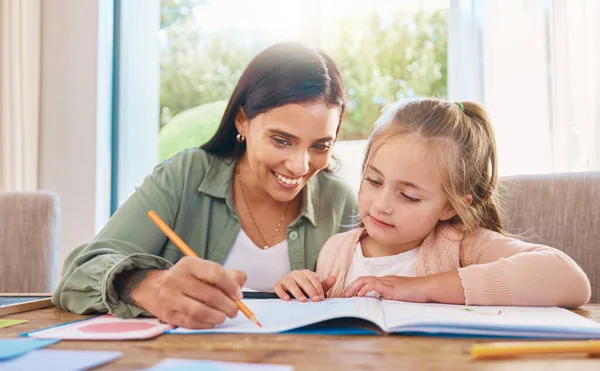 Writing, helping and happy mother with girl for home education, language support and creative development. Family, biracial mom or woman teaching child, learning and drawing in book for creativity.