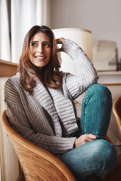 stock image I need to do this more often. an attractive young woman relaxing on a chair at home