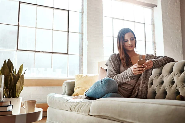 Spending Day Indoors Attractive Young Woman Using Her Cellphone While — Stock Photo, Image