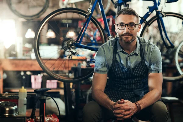 stock image Ive got your bikes best interests at heart. Portrait of a mature man working in a bicycle repair shop