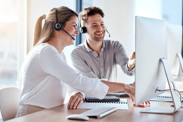 Computer, collaboration and customer service with a consultant team working in a call center for support. Teamwork, crm or contact us with a man and woman employee at work in a consulting office.