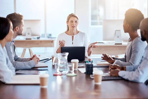 Business people, coaching and meeting in strategy, idea or team collaboration at the office. Corporate woman in leadership talking to staff in teamwork, brainstorming or project planning at workplace.