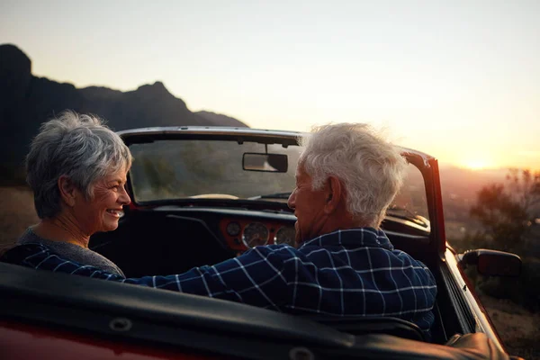 Going on a good old road trip. a senior couple enjoying a road trip