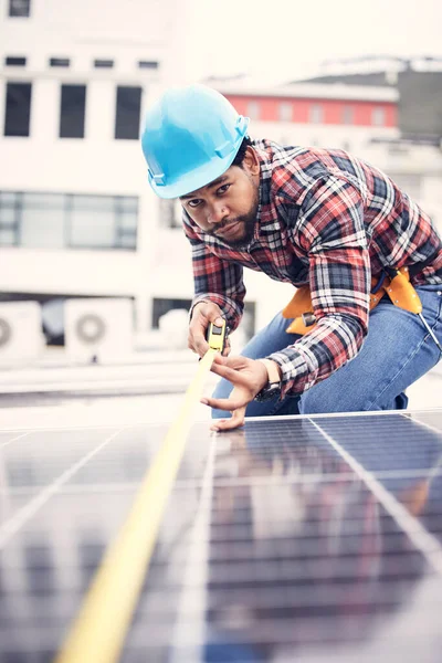 Engineer man, measuring tape or roof solar panel in sustainable planning, clean energy or development. African technician, photovoltaic or installation system for power, sustainability or electricity.