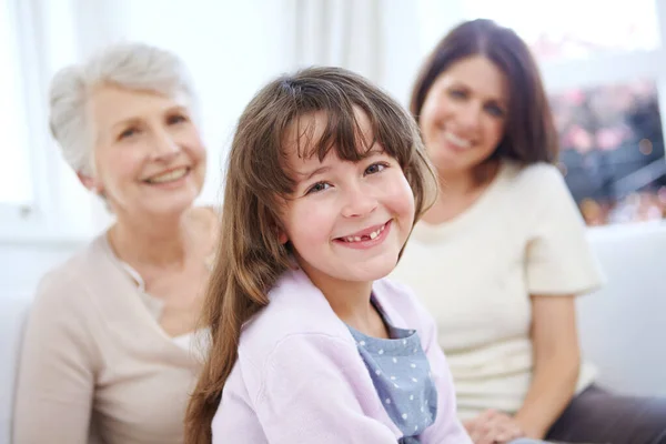 stock image Family time is the best. Portrait of an adorable little girl with her mother and grandmother in the background