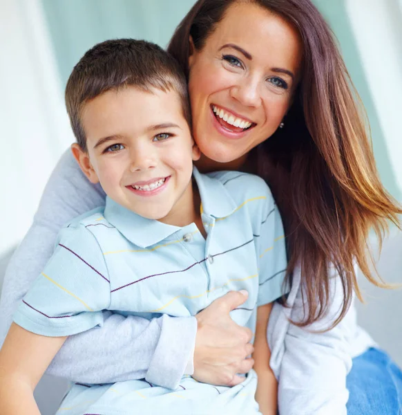 stock image Family love. Close up portrait of a young mother and her son smiling at the camera