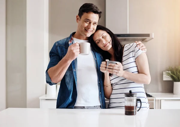 stock image Kickstart the day with coffee and love. a happy young couple having coffee together at home