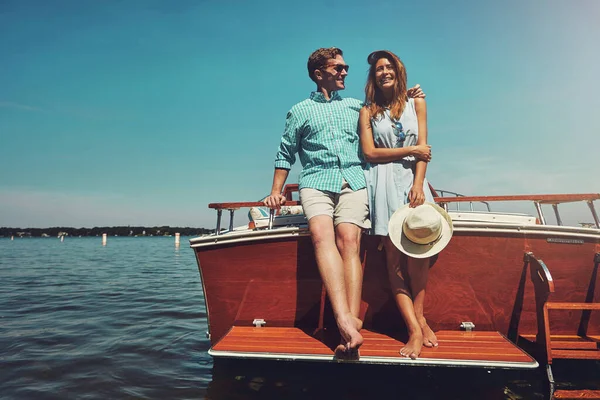 Sunshine, romance and a boat. Good times guaranteed. a young couple spending time together on a yacht