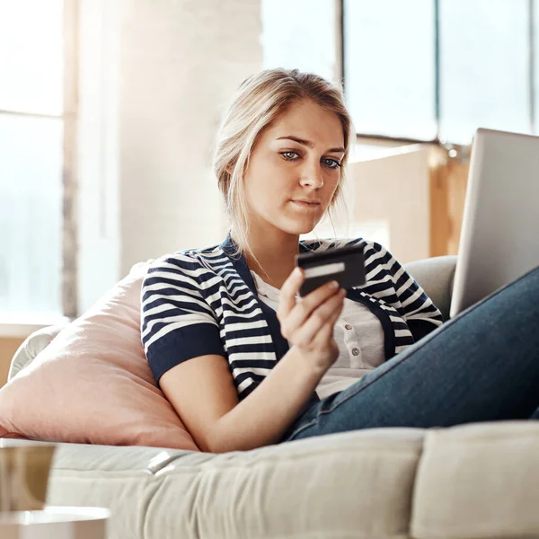 Should Buy Thoughtful Young Woman Relaxing Sofa Using Credit Card — Stock Photo, Image