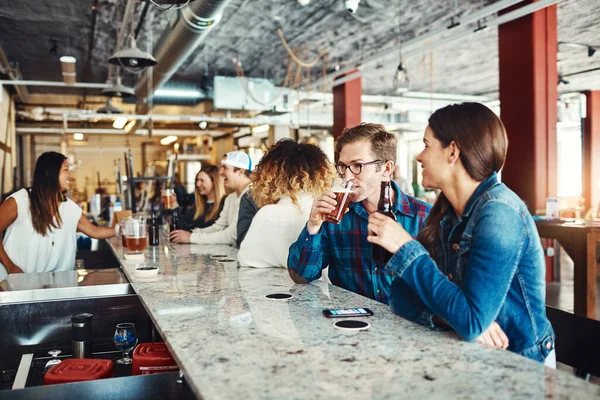 stock image The best seat in the bar. a couple enjoying a drink at a bar