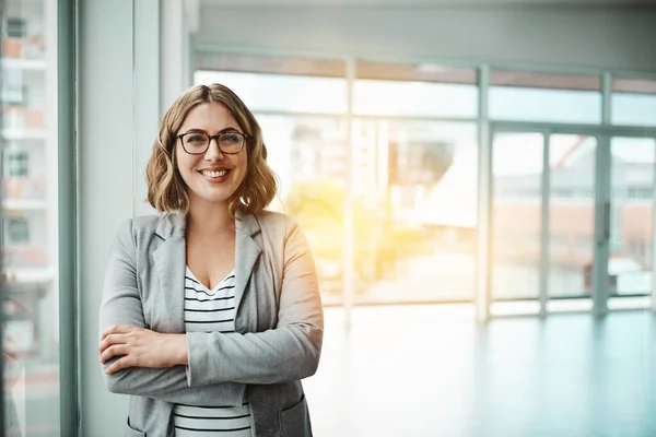 stock image I never do anything without utmost confidence. Portrait of a confident young businesswoman standing in an office