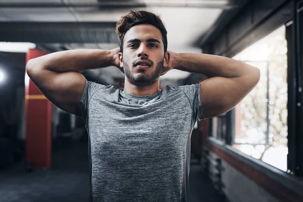 stock image Get healthy and stay healthy. Portrait of a handsome young man at the gym for a workout