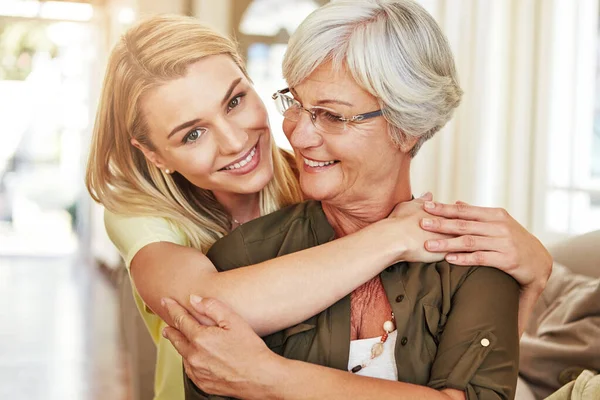 stock image Keep you mother as close as you can. a senior woman and her adult daughter at home